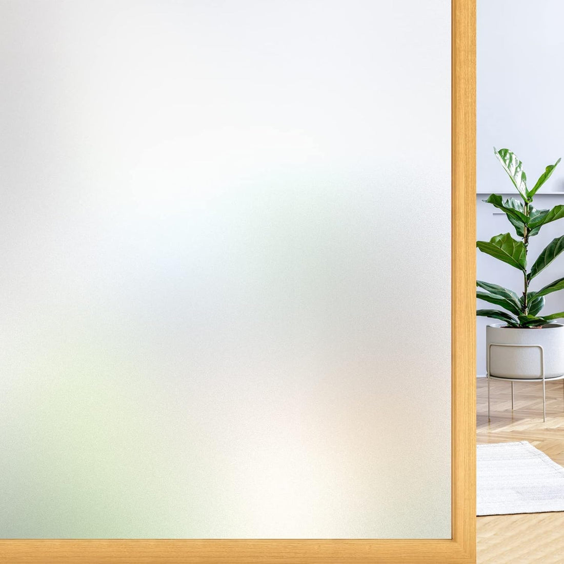 Frosted privacy window film providing natural light and complete privacy in bathroom