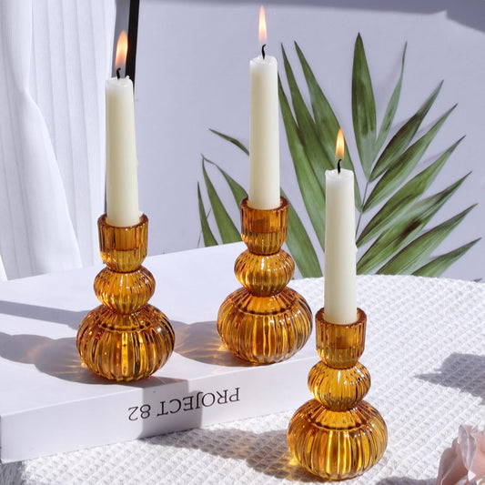Set of 3 amber glass candle holders with stacked pumpkin design and vertical ribbed texture