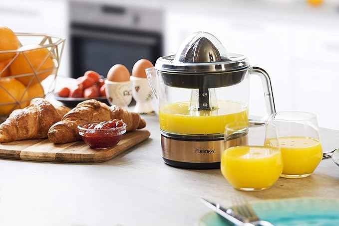 Bestron Juicer, electric citrus and orange juicer, incl. 2 juicer cones and aromatic lid, motor with two directions of rotation (left/right), capacity: 0.7 litres, 40 watts, covers