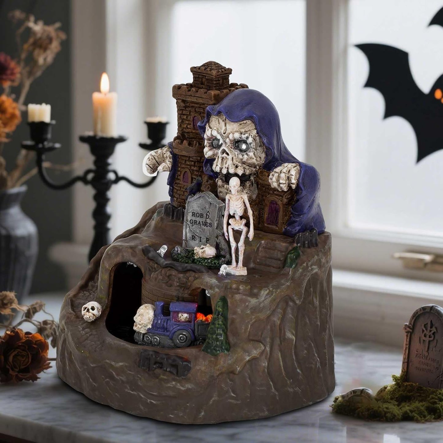 innodept12 Animated Halloween Small Village House - Moving Train and Skull Ghosts Tombstones Figurines with Pre-Lit Spooky Voice, Battery Operated, Not Including
